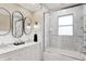 Elegant bathroom with marble tile, double vanity, and a large shower at 4621 N Meridian St, Indianapolis, IN 46208