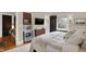 Spacious bedroom with a king-size bed, built-in bar, and hardwood floors at 4621 N Meridian St, Indianapolis, IN 46208