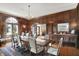 Formal dining room with wood paneling, a large table, and a beautiful chandelier at 4621 N Meridian St, Indianapolis, IN 46208