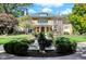 Grand two-story home with a green tile roof and manicured lawn at 4621 N Meridian St, Indianapolis, IN 46208