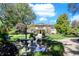 Elegant home with a fountain and beautifully landscaped front yard at 4621 N Meridian St, Indianapolis, IN 46208