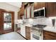 Bright kitchen boasts updated cabinetry, stainless steel appliances, and subway tile backsplash at 4621 N Meridian St, Indianapolis, IN 46208