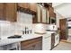 Updated kitchen with stainless steel appliances and custom wood cabinets at 4621 N Meridian St, Indianapolis, IN 46208