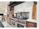 Updated kitchen with stainless steel appliances and a large range at 4621 N Meridian St, Indianapolis, IN 46208