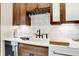 Custom kitchen features white quartz countertops, farmhouse sink, and wine rack at 4621 N Meridian St, Indianapolis, IN 46208