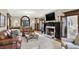 Elegant living room with a marble fireplace, leather sofas, and hardwood floors at 4621 N Meridian St, Indianapolis, IN 46208