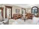 Spacious living room with leather sofas, coffee table, and hardwood floors at 4621 N Meridian St, Indianapolis, IN 46208
