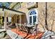 Brick patio with a large dining table and chairs, ideal for outdoor entertaining at 4621 N Meridian St, Indianapolis, IN 46208