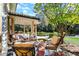 Relaxing patio features comfortable seating, a small table, and lush landscaping at 4621 N Meridian St, Indianapolis, IN 46208