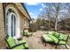 Spacious patio with a green couch and chairs, perfect for outdoor relaxation at 4621 N Meridian St, Indianapolis, IN 46208