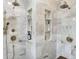 Luxurious shower with marble tile, built-in shelves, and dual shower heads at 4621 N Meridian St, Indianapolis, IN 46208