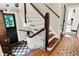Wood staircase with white spindles and checkerboard floor at 4621 N Meridian St, Indianapolis, IN 46208