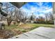 Backyard with a wooden deck, playground set, and mature trees at 4817 Welton St, Greenwood, IN 46143