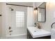 Updated bathroom with subway tile and modern vanity at 5116 Carrollton Ave, Indianapolis, IN 46205