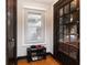 Bright entryway with shoe storage and hardwood floors at 5116 Carrollton Ave, Indianapolis, IN 46205