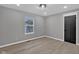 Spacious bedroom with neutral walls and wood-look flooring at 5184 N Vance St, Columbus, IN 47201