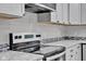 Stainless steel range and granite countertop in modern kitchen at 5184 N Vance St, Columbus, IN 47201