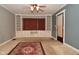 Living room with built-in shelving and a ceiling fan at 565 N Rural St, Indianapolis, IN 46201