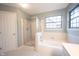 Bathroom with shower, bathtub and tile flooring at 7589 Willow Rdg, Fishers, IN 46038