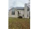 Two story house, light beige siding, large windows, and a chimney at 7589 Willow Rdg, Fishers, IN 46038