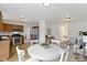 Open concept dining area with white table and chairs, adjacent to kitchen at 8022 Buford St, Indianapolis, IN 46216