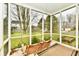 Screened porch with a swing and view of the backyard at 8863 Gardenia Ct, Noblesville, IN 46060