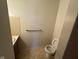 Small bathroom with toilet and sink at 931 W Mckay Rd, Shelbyville, IN 46176