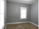 Well-lit bedroom with gray walls and carpet flooring at 1314 Arrow Ave, Anderson, IN 46016