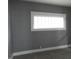 Simple bedroom with gray walls and carpet flooring at 1314 Arrow Ave, Anderson, IN 46016