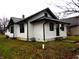 White house with black accents, steps, and a small lawn at 1314 Arrow Ave, Anderson, IN 46016