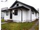 White house with black accents and a small lawn at 1314 Arrow Ave, Anderson, IN 46016