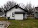 Rear view of a white house with a gray door at 1314 Arrow Ave, Anderson, IN 46016