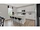 Modern kitchen with island, stainless steel appliances, and white cabinetry at 1853 Grand Vista Blvd, Greenwood, IN 46143