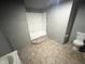 Clean bathroom with shower/tub combo and tile flooring at 2134 Pleasant St, Indianapolis, IN 46203