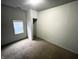Small bedroom with neutral walls and carpeted floors at 2134 Pleasant St, Indianapolis, IN 46203