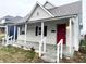 One-story home with a covered porch and gray siding at 2134 Pleasant St, Indianapolis, IN 46203