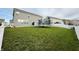 Large backyard with a trampoline and white vinyl fence at 5128 Macaferty St, Plainfield, IN 46168