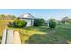 Detached garage with manicured lawn and shrubs at 801 Spring Valley Dr, Indianapolis, IN 46231