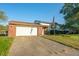 Brick ranch home with attached garage and American flag at 801 Spring Valley Dr, Indianapolis, IN 46231