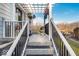 Back porch with pergola and stairs leading to the backyard at 2222 E 75Th St, Indianapolis, IN 46240
