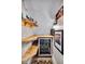 Convenient basement bar with wine cooler and shelving at 2222 E 75Th St, Indianapolis, IN 46240