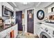 Basement laundry room with washer, dryer, and granite countertop at 2222 E 75Th St, Indianapolis, IN 46240
