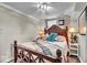 Basement bedroom with wooden bed frame and neutral bedding at 2222 E 75Th St, Indianapolis, IN 46240