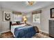 Cozy bedroom with a comfortable bed and neutral decor at 2222 E 75Th St, Indianapolis, IN 46240