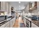 Modern kitchen with granite countertops and stainless steel appliances at 2222 E 75Th St, Indianapolis, IN 46240