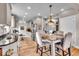 Modern kitchen with light cabinets, granite counters, and breakfast table at 2222 E 75Th St, Indianapolis, IN 46240