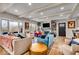 Open living room with stone fireplace and hardwood floors at 2222 E 75Th St, Indianapolis, IN 46240