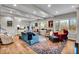 Bright living room with hardwood floors, comfortable seating, and large windows at 2222 E 75Th St, Indianapolis, IN 46240