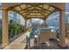 Cozy patio with seating area under a pergola at 2222 E 75Th St, Indianapolis, IN 46240