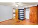 Hardwood floor bedroom with a view of the kitchen and closet at 4406 Skylark Dr, Indianapolis, IN 46239